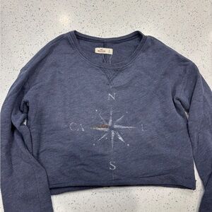 Hollister Co. blue crewneck sweatshirt.